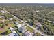 Aerial view of a residential area showing homes, roads, and lush greenery at 17152 Wintergarden Ave, Port Charlotte, FL 33948