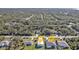 Aerial view of the property showcasing its location amongst lush greenery, near waterfront and other homes at 17152 Wintergarden Ave, Port Charlotte, FL 33948