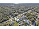 Aerial view of a residential area showing homes, roads, and lush greenery at 17152 Wintergarden Ave, Port Charlotte, FL 33948