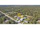 Overhead view of property showcasing its location amidst a lush landscape with surrounding homes at 17152 Wintergarden Ave, Port Charlotte, FL 33948