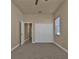 Neutral bedroom with a ceiling fan, a window and a closet at 17152 Wintergarden Ave, Port Charlotte, FL 33948