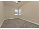 Bedroom features neutral carpeting, recessed lighting and a ceiling fan with two windows at 17152 Wintergarden Ave, Port Charlotte, FL 33948