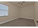 Neutral bedroom with a ceiling fan, and a window at 17152 Wintergarden Ave, Port Charlotte, FL 33948