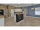 Bright kitchen and dining area showcasing tiled floors and open spaces at 17152 Wintergarden Ave, Port Charlotte, FL 33948