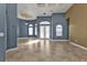 Open living space featuring tiled floors, high ceilings, and natural light at 17152 Wintergarden Ave, Port Charlotte, FL 33948