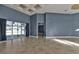 Bright living room with tile floors, large sliding glass doors, and recessed ceiling at 17152 Wintergarden Ave, Port Charlotte, FL 33948