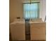 Full-sized washer and dryer in the laundry room at 17212 Ursula Ave, Port Charlotte, FL 33954