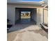 Attached garage with an automatic door opener, providing convenient vehicle access at 22206 Laramore Ave, Port Charlotte, FL 33952