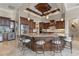 Gourmet kitchen featuring granite island and custom cabinetry at 238 Lido Dr, Punta Gorda, FL 33950