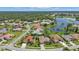 Aerial view of a residential neighborhood near a lake at 2388 Silver Palm Rd, North Port, FL 34288