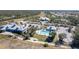 Community pool and clubhouse with ample parking and lake views at 2388 Silver Palm Rd, North Port, FL 34288