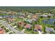 Aerial view of a community near a lake, showing multiple homes at 2388 Silver Palm Rd, North Port, FL 34288