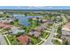 Aerial view of homes near a lake in a peaceful community at 2388 Silver Palm Rd, North Port, FL 34288