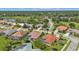 Aerial view of a residential area, showcasing homes with pools and landscaping at 2388 Silver Palm Rd, North Port, FL 34288