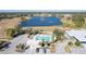 Community pool and clubhouse with ample parking and lake views at 2388 Silver Palm Rd, North Port, FL 34288