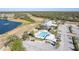 Community pool and clubhouse with ample parking and lake views at 2388 Silver Palm Rd, North Port, FL 34288
