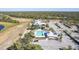 Community pool and clubhouse with ample parking and lake views at 2388 Silver Palm Rd, North Port, FL 34288