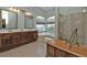 Bathroom with double vanity, soaking tub and separate shower at 2388 Silver Palm Rd, North Port, FL 34288