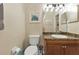 Small bathroom with toilet and vanity at 2388 Silver Palm Rd, North Port, FL 34288