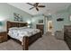 Main bedroom with king bed, dresser and sitting area at 2388 Silver Palm Rd, North Port, FL 34288