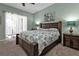Spacious bedroom with a king-size bed and access to a balcony at 2388 Silver Palm Rd, North Port, FL 34288