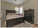 Bedroom with a double bed and dresser at 2388 Silver Palm Rd, North Port, FL 34288