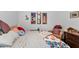 Cozy bedroom with a double bed and dresser at 2388 Silver Palm Rd, North Port, FL 34288