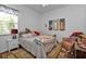 Guest bedroom with a full-size bed and coastal decor at 2388 Silver Palm Rd, North Port, FL 34288