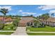 Attractive single-story home with tile roof, landscaping, and two-car garage at 2388 Silver Palm Rd, North Port, FL 34288