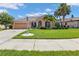 House exterior showcasing a well-maintained lawn and driveway at 2388 Silver Palm Rd, North Port, FL 34288