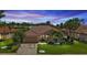 Single-Gathering home with tile roof and landscaped yard at dusk at 2388 Silver Palm Rd, North Port, FL 34288