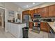 Kitchen boasts stainless steel appliances and ample wood cabinetry at 2388 Silver Palm Rd, North Port, FL 34288