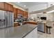 Kitchen boasts stainless steel appliances and ample wood cabinetry at 2388 Silver Palm Rd, North Port, FL 34288