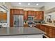 Kitchen boasts stainless steel appliances and ample wood cabinetry at 2388 Silver Palm Rd, North Port, FL 34288