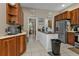 Kitchen boasts stainless steel appliances and ample wood cabinetry at 2388 Silver Palm Rd, North Port, FL 34288