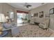 Spacious living room with pool view, comfortable seating and large area rug at 2388 Silver Palm Rd, North Port, FL 34288