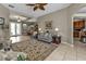Spacious living room featuring comfy seating and access to pool area at 2388 Silver Palm Rd, North Port, FL 34288