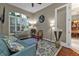 Cozy home office with comfortable seating and a large window at 2388 Silver Palm Rd, North Port, FL 34288