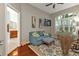 Home office with hardwood floors, and view of bathroom at 2388 Silver Palm Rd, North Port, FL 34288