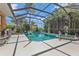 Inviting screened pool and spa with ample surrounding patio space at 2388 Silver Palm Rd, North Port, FL 34288