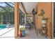 Relaxing pool area with covered patio, spa, and outdoor seating at 2388 Silver Palm Rd, North Port, FL 34288