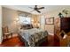 Cozy bedroom with hardwood floors and a floral bedspread at 240 Divinci Dr, Punta Gorda, FL 33950