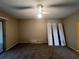 Spacious living room with carpeted floors and ceiling fan at 25068 Harborview Rd # 1A, Punta Gorda, FL 33980