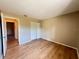 Inviting bedroom with wood floors and a closet at 25068 Harborview Rd # 1A, Punta Gorda, FL 33980