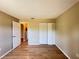 Cozy bedroom featuring hardwood floors, a closet, and neutral paint colors at 25068 Harborview Rd # 1A, Punta Gorda, FL 33980