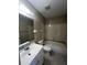 Bathroom with bathtub, toilet and sink at 25068 Harborview Rd # 1A, Punta Gorda, FL 33980