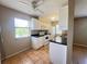 Bright kitchen with tile flooring, white appliances, and ample counter space at 25068 Harborview Rd # 1A, Punta Gorda, FL 33980