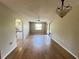 Spacious living room with wood-look floors is open to the kitchen and dining area at 25068 Harborview Rd # 1A, Punta Gorda, FL 33980