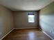 Bedroom with hardwood floors and window at 25068 Harborview Rd # 1A, Punta Gorda, FL 33980