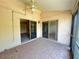 Inviting patio offers access to the outdoors, with a ceiling fan and sliding glass doors at 25068 Harborview Rd # 1A, Punta Gorda, FL 33980